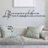 Life is not measured by the breaths we take but by the moments that take our breath away. wall quotes vinyl lettering wall decal inspiration graduation wedding love marriage motivation
