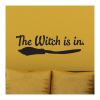 The witch is in . (over top of black broom)